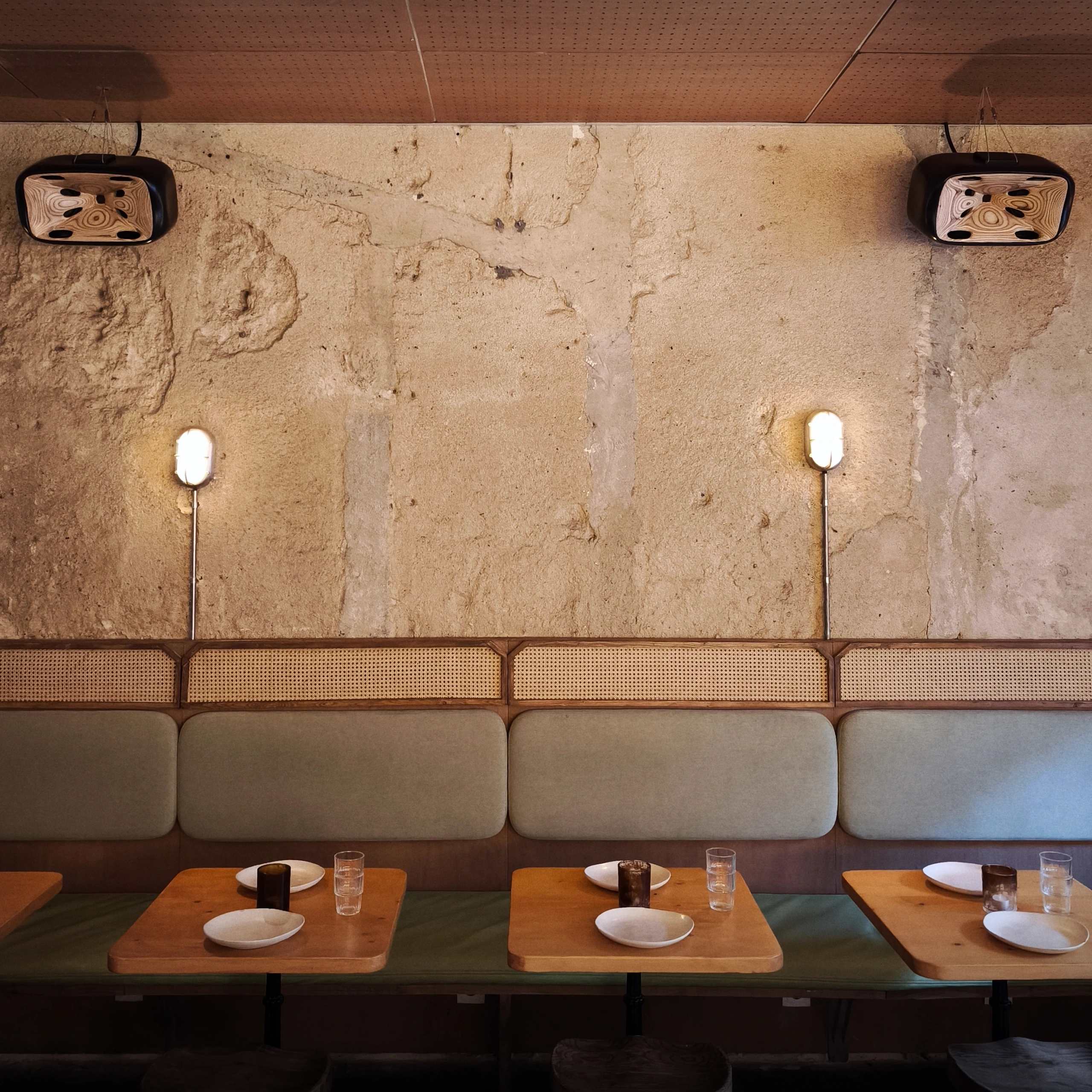 Two Cohérence 5 on a stone wall above the banquettes at Boa Vista Social Club in Lisbon